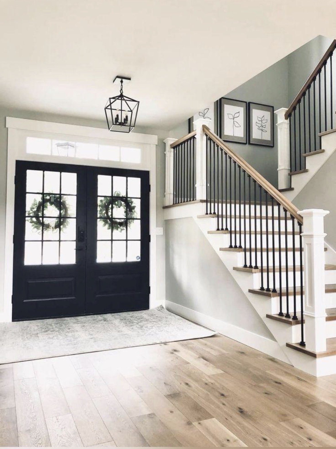 Luxury entryway with stairs and railings